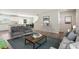 Cozy living room showcases an open floor plan, hardwood floors and access to kitchen at 16 Powder Ct, Angier, NC 27501
