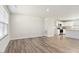 Open living room flowing into a bright, modern kitchen at 16 Powder Ct, Angier, NC 27501