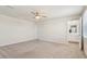 Carpeted main bedroom with an ensuite bathroom, ceiling fan, and great natural light at 16 Powder Ct, Angier, NC 27501