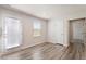 Bright living room with hardwood floors and several doors at 16 Powder Ct, Angier, NC 27501