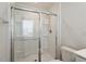 Modern shower with glass door, built-in shelves, and a rainfall showerhead at 16 Powder Ct, Angier, NC 27501