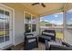 Screened back porch with ceiling fan and a four-piece cushioned seating set at 16 Woodglen Dr, Clayton, NC 27527