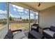 Wide angle of screened-in back porch, showcasing an outdoor seating area at 16 Woodglen Dr, Clayton, NC 27527