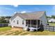 Aerial backyard view of a home with a covered porch, grill and fenced yard at 16 Woodglen Dr, Clayton, NC 27527