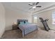 Spacious bedroom featuring neutral paint, a ceiling fan, and comfortable carpeting at 16 Woodglen Dr, Clayton, NC 27527