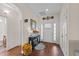 Inviting foyer with wood floors, console table, and decorative mirror creating a welcoming entry at 16 Woodglen Dr, Clayton, NC 27527
