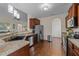Functional kitchen with stainless steel appliances, granite countertops, and dark wood cabinets at 16 Woodglen Dr, Clayton, NC 27527
