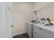 Laundry room with tile floors, Maytag washer and dryer, and wire shelf at 16 Woodglen Dr, Clayton, NC 27527