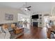 Cozy living room features a ceiling fan, fireplace, and open layout for comfortable living at 16 Woodglen Dr, Clayton, NC 27527