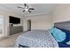 Comfortable main bedroom with neutral walls, ceiling fan, and walk-in closet at 16 Woodglen Dr, Clayton, NC 27527