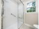 Modern bathroom with glass-enclosed shower and neutral tones, providing a clean and refreshing space at 1708 Lake Park Dr, Raleigh, NC 27612