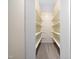 Walk-in closet with multiple shelves and neutral carpet at 1708 Lake Park Dr, Raleigh, NC 27612