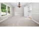 Bright dining room with carpet, neutral walls and decorative lighting at 1708 Lake Park Dr, Raleigh, NC 27612