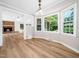 Dining area with hardwood flooring, a bay window and views to the living room at 1708 Lake Park Dr, Raleigh, NC 27612