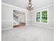 Bright living room with carpet, neutral walls and decorative lighting at 1708 Lake Park Dr, Raleigh, NC 27612