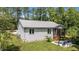 Aerial view of the house with lush lawn, the back patio and screen porch offering serene outdoor living at 174 Sequoia Dr, Louisburg, NC 27549