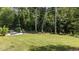 Expansive backyard with lush greenery and a patio area, perfect for outdoor activities and entertaining at 174 Sequoia Dr, Louisburg, NC 27549