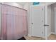 Bathroom features a shower with a curtain and neutral decor, blending style and functionality at 174 Sequoia Dr, Louisburg, NC 27549