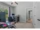 Bedroom featuring a cozy workspace with a large window, a ceiling fan, and neutral decor at 174 Sequoia Dr, Louisburg, NC 27549