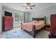 Spacious bedroom with a window, ceiling fan, and neutral colors at 174 Sequoia Dr, Louisburg, NC 27549