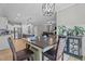 Open dining area showcases a view of the modern kitchen and cozy living space at 174 Sequoia Dr, Louisburg, NC 27549