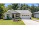 Charming single-Gathering home with tidy landscaping, a two-car garage, and delightful curb appeal at 174 Sequoia Dr, Louisburg, NC 27549