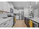 The kitchen boasts stainless steel appliances, subway tile backsplash, and stylish cabinetry at 174 Sequoia Dr, Louisburg, NC 27549