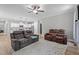 Open living area connected to the kitchen, with neutral tones, and a cozy atmosphere at 174 Sequoia Dr, Louisburg, NC 27549