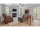 Comfortable living room features a fireplace, ceiling fan, and lots of natural light at 174 Sequoia Dr, Louisburg, NC 27549