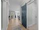 Bright entryway with an interior view of a modern kitchen and open living spaces at 174 Sequoia Dr, Louisburg, NC 27549