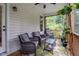 Relax on this screened porch that offers a tranquil view of nature and wooded backyard at 174 Sequoia Dr, Louisburg, NC 27549