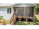 This home features an inviting screened porch accessible by a wooden staircase at 174 Sequoia Dr, Louisburg, NC 27549