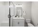 Bathroom with glass shower, sink, vanity, toilet and modern fixtures at 20 Delia Ln, Pittsboro, NC 27312