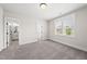 Bedroom with hardwood flooring, a view into the bathroom and natural light from a window at 20 Delia Ln, Pittsboro, NC 27312