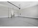 Well-lit garage with epoxy flooring, showcasing ample space and convenient access stairs to the house at 20 Delia Ln, Pittsboro, NC 27312