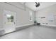 Bright, clean garage featuring an epoxy floor, ample storage space, and a convenient access door to the exterior at 20 Delia Ln, Pittsboro, NC 27312