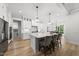 Open-concept kitchen with stainless steel appliances, pendant lighting, and a breakfast bar with seating at 20 Delia Ln, Pittsboro, NC 27312