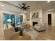 Cozy living room with a fireplace, hardwood floors, and sliding doors to the deck at 20 Delia Ln, Pittsboro, NC 27312