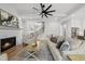 Inviting living room with a cozy fireplace, comfortable seating, and an open layout for easy entertaining at 20 Delia Ln, Pittsboro, NC 27312