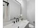 Contemporary powder room with a sleek vanity, modern mirror, and stylish fixtures, offering a touch of elegance at 20 Delia Ln, Pittsboro, NC 27312