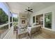 The screened porch features a cozy fireplace, comfortable seating, and a serene view of the lush, green backyard at 20 Delia Ln, Pittsboro, NC 27312