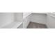 Walk-in closet with custom shelves, carpeted floor and natural light at 20 Delia Ln, Pittsboro, NC 27312