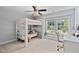 Bedroom with bunk bed, desk, and large windows offering natural light at 200 Woodvale Way, Fuquay Varina, NC 27526