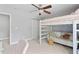 Bedroom featuring a bunk bed with seating underneath, a closet and carpeting at 200 Woodvale Way, Fuquay Varina, NC 27526