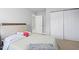 Bedroom featuring a bed with cushioned headboard and an access door to another room at 200 Woodvale Way, Fuquay Varina, NC 27526
