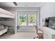 Bedroom with bunk bed, desk, and large windows offering natural light at 200 Woodvale Way, Fuquay Varina, NC 27526