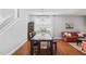 Bright dining room with hardwood floors and a stylish chandelier at 200 Woodvale Way, Fuquay Varina, NC 27526