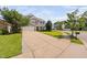 Charming two-story home with a long driveway and well-manicured lawn at 200 Woodvale Way, Fuquay Varina, NC 27526