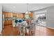 Open kitchen and dining area with bar stool seating and backyard views at 200 Woodvale Way, Fuquay Varina, NC 27526