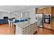 Bright and spacious kitchen with granite countertops, stainless steel appliances, and open layout to dining area at 200 Woodvale Way, Fuquay Varina, NC 27526